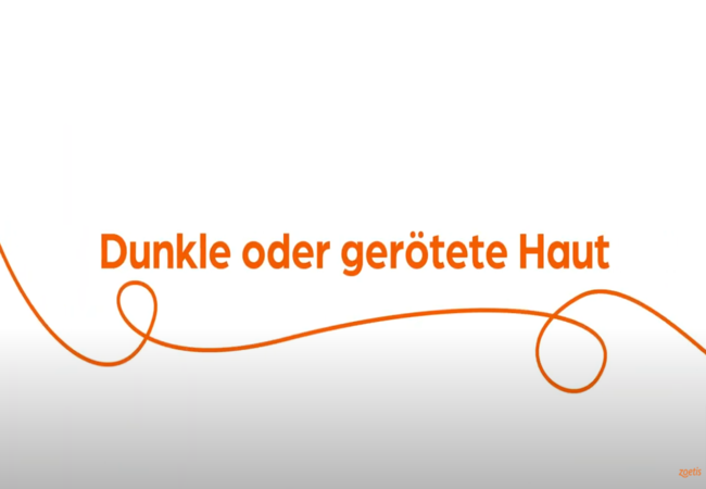 Text „Dunkle oder gerötete Haut“ mit orangefarbener Spirale auf weißem Hintergrund.